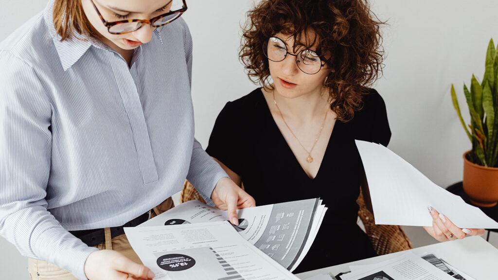 Two Women Doing Their Paperwork