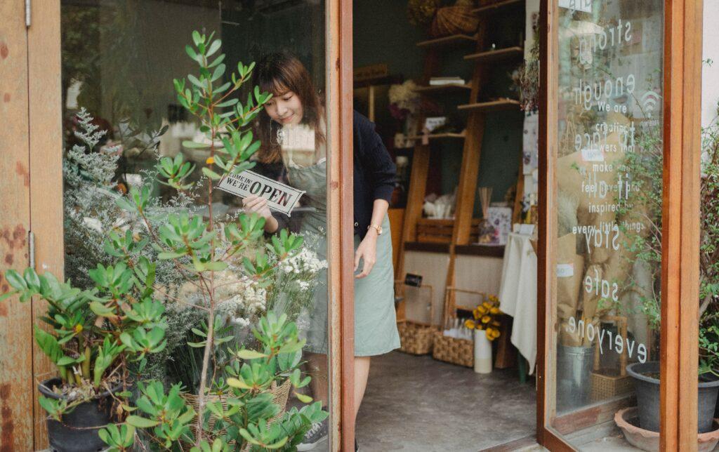 florist small business owner opening her shop
