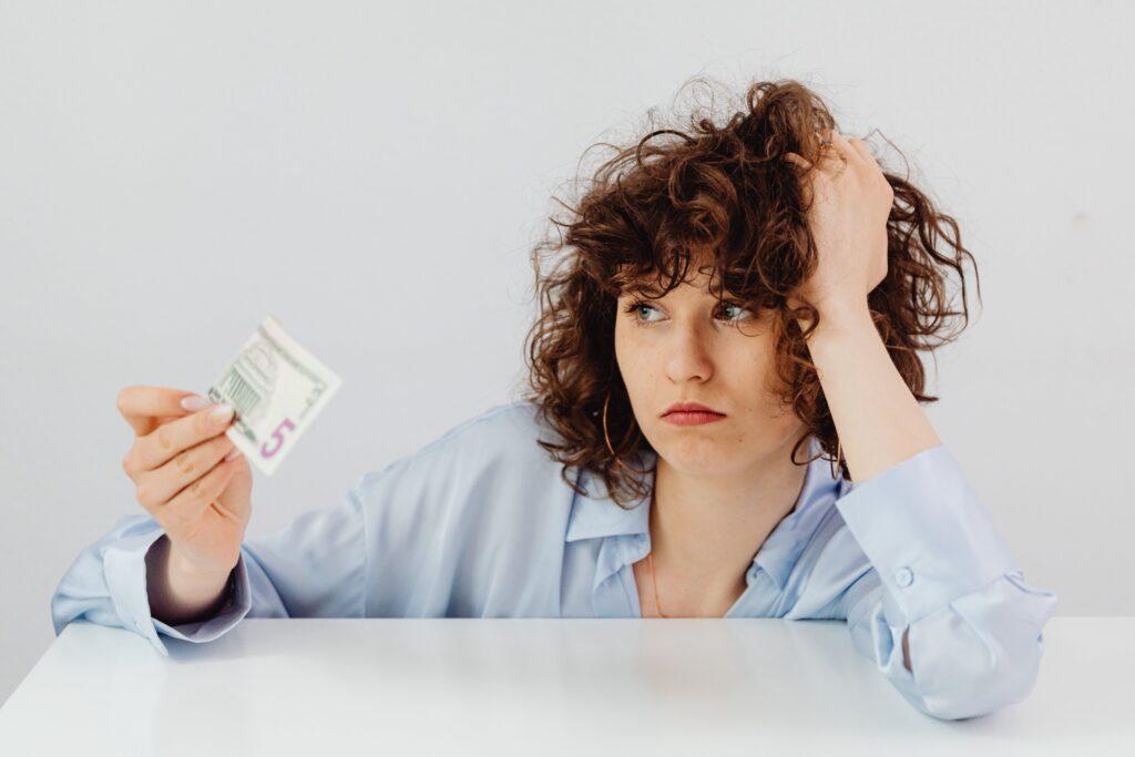female business owner looking concerned about financial matters